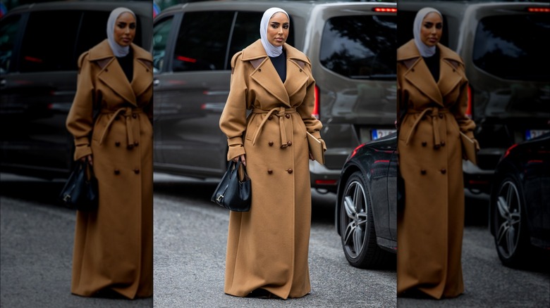 woman wearing trench-style coat