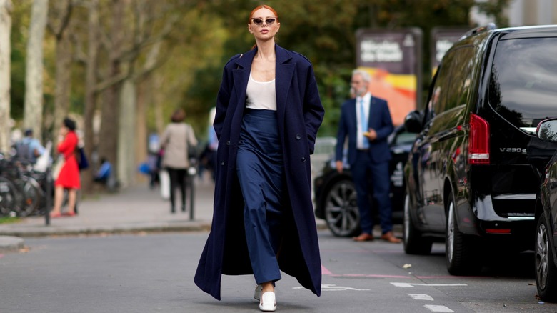 woman wearing navy blue coat