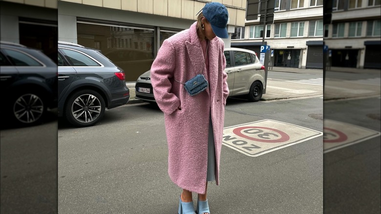 woman wearing pink fuzzy coat