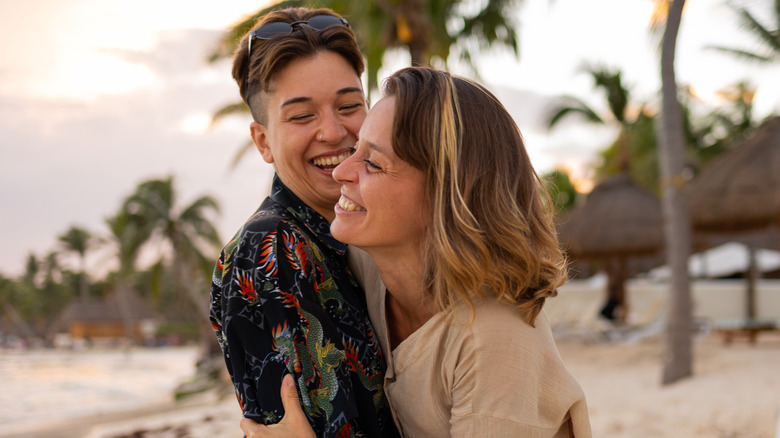 laughing couple on beach