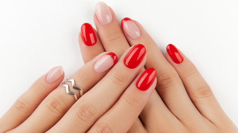 Manicure with red and clear polish