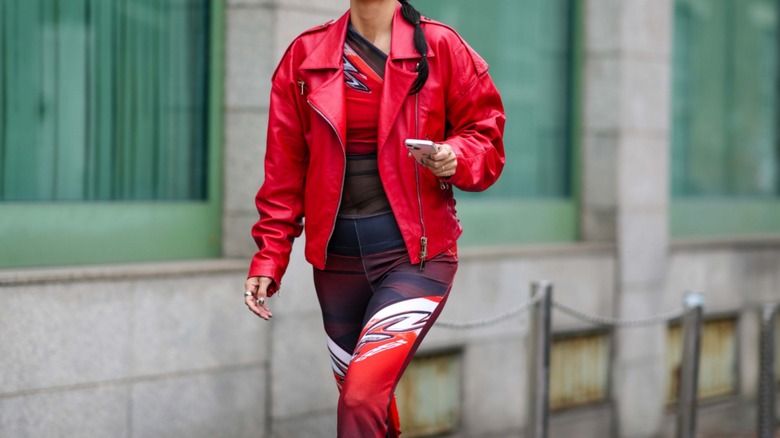 woman wearing red leather jacket