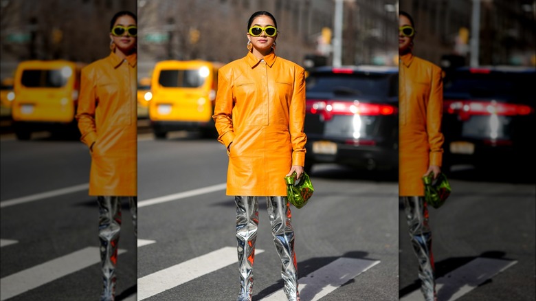 woman wearing orange leather dress