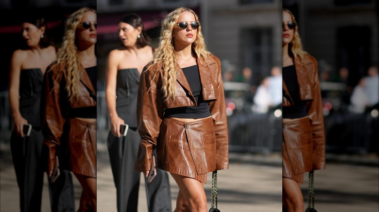 woman wearing brown leather set