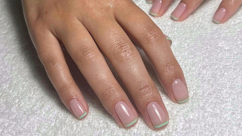 manicure with green pastel French tips