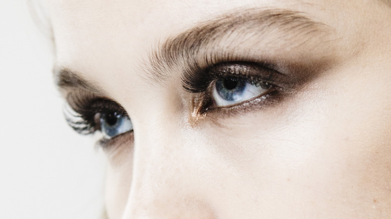 woman wearing metallic eye shadow