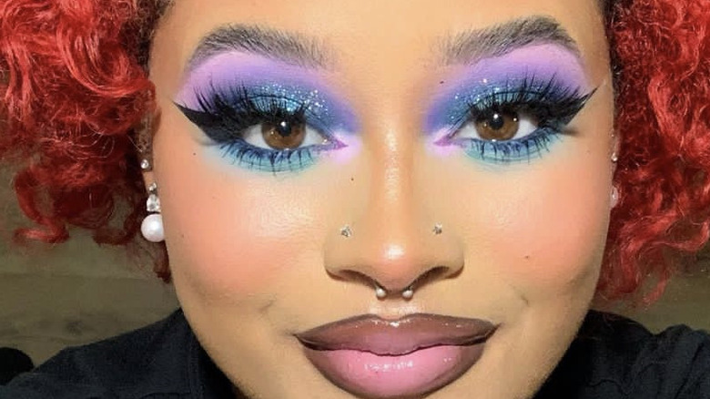 woman wearing colorful eye makeup selfie