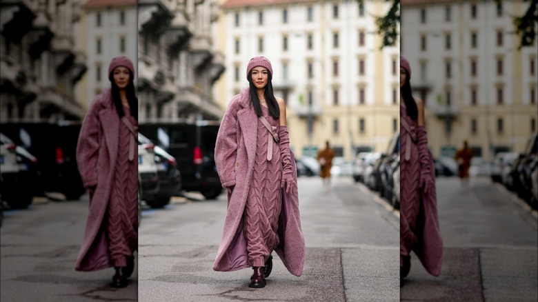 Woman wearing dusty blush maxi dress and matching coat