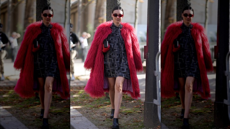 Woman wearing maxi red faux-fur coat