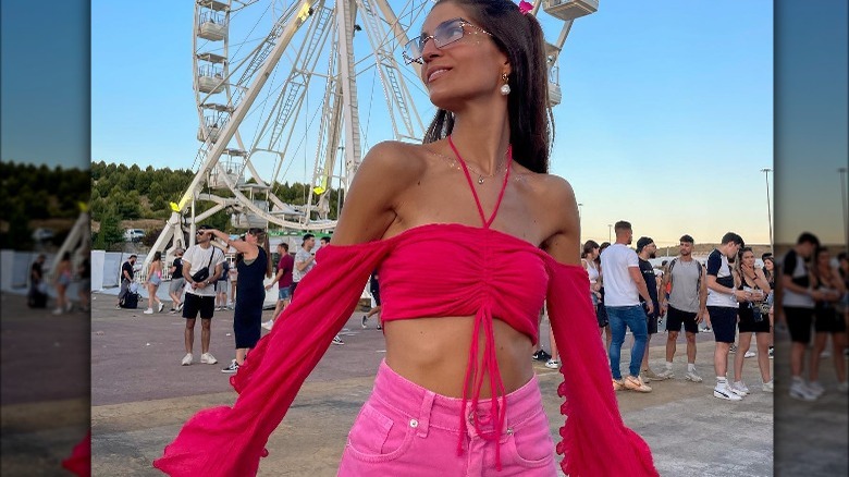 Woman wearing red, pink outfit