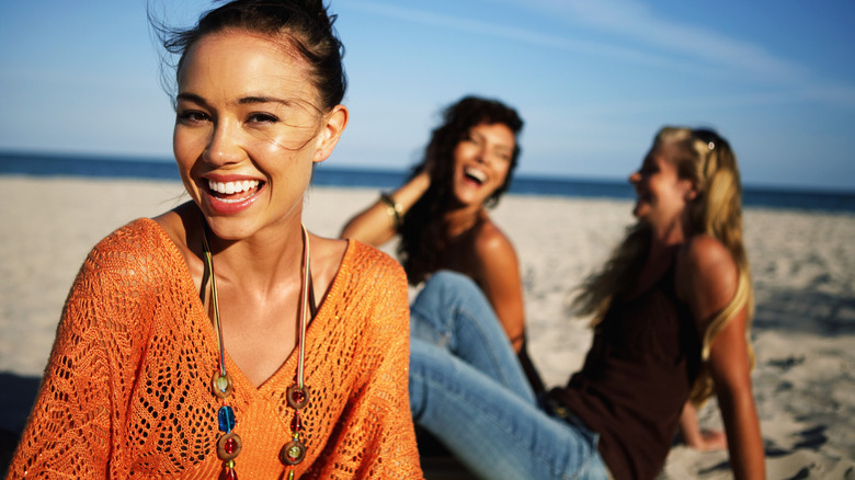 Women laughing on the beach