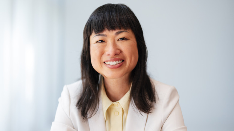 Woman with dark bangs