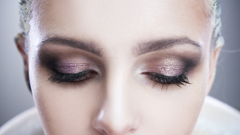 A woman with glitter eyeshadow