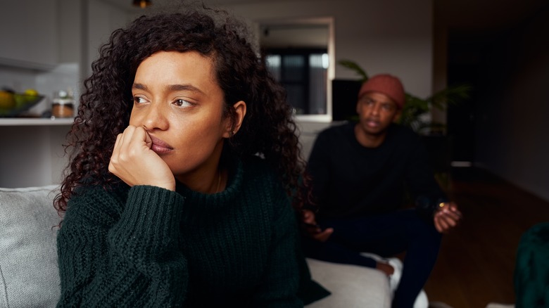 unhappy couple on couch