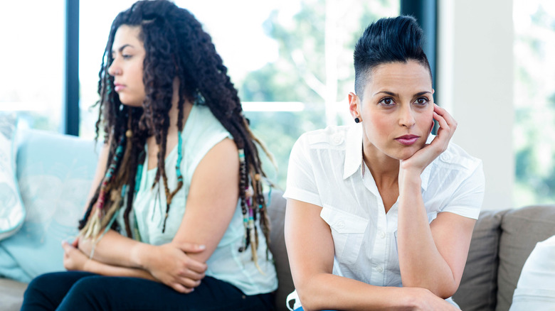 Two upset women on couch