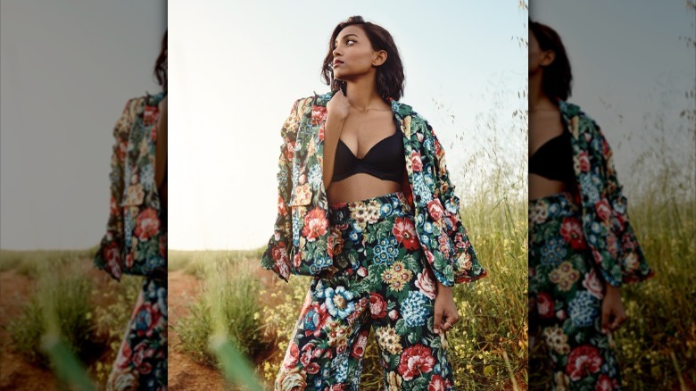 Fashionable woman wearing floral suit