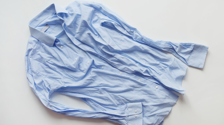 Wrinkled blue button-up shirt