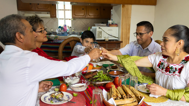 family toasting around table