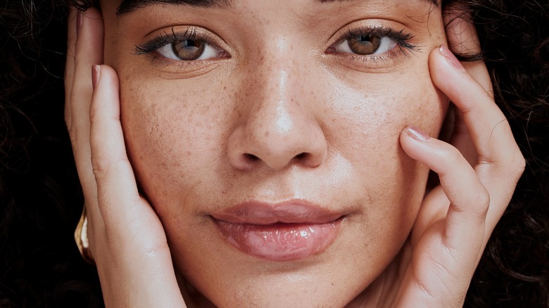 Close up of woman's face with freckles