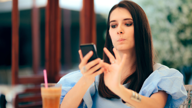 Woman scrolling on phone 