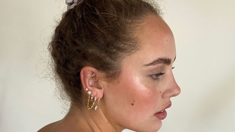Girl with ear constellation piercings