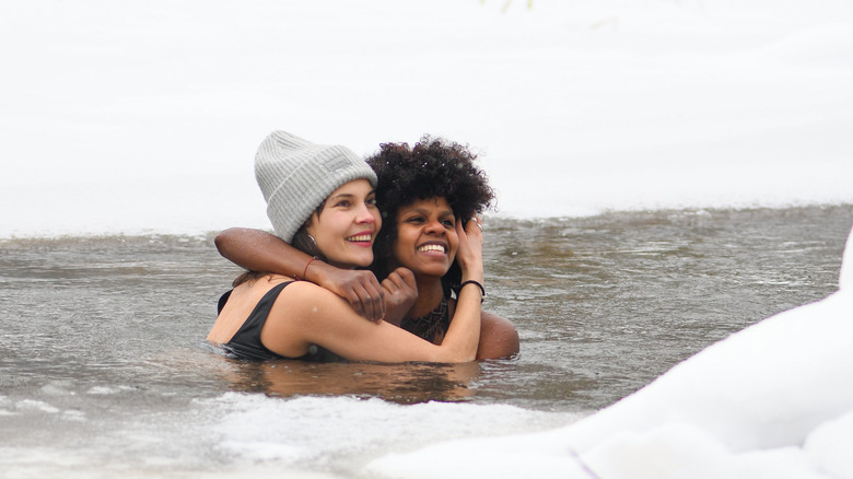 Two women in icy lake