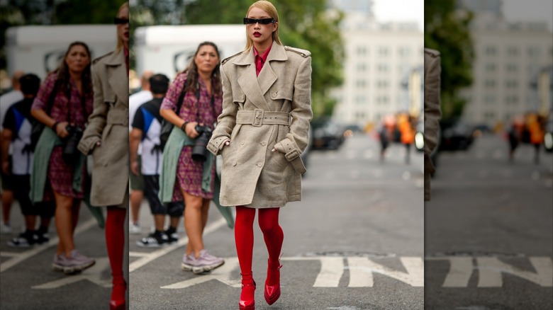 woman wearing trench and red tights