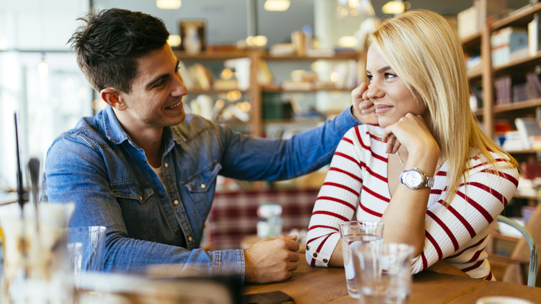 man charming woman on date