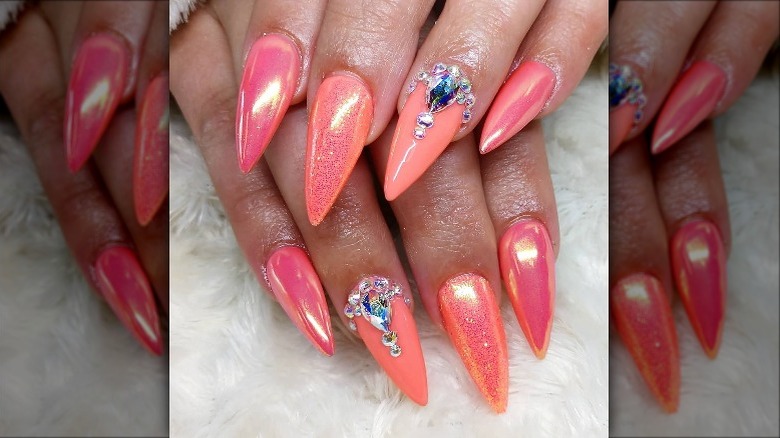 Woman wearing gemstones on her nails
