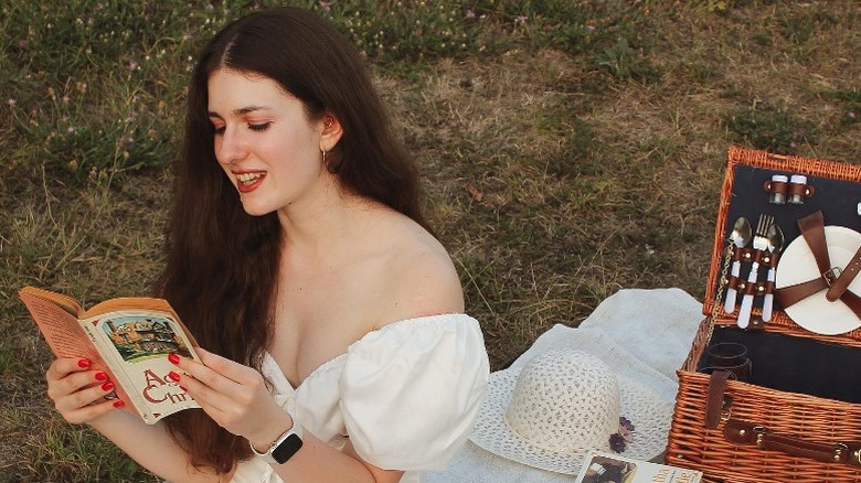 woman reading in a field