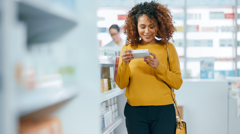 Smiling woman at pharmacy