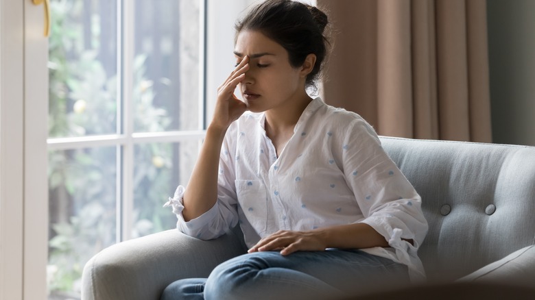 woman experiencing stress and discomfort