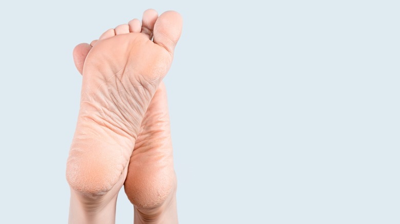 dry feet on pale blue background