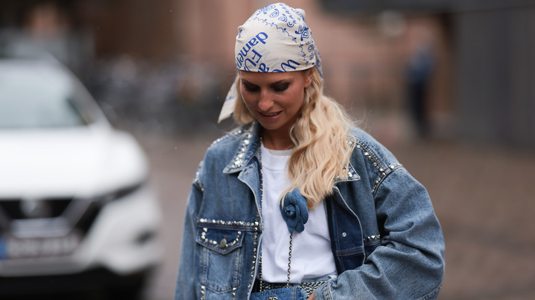 woman wearing embellished denim jacket