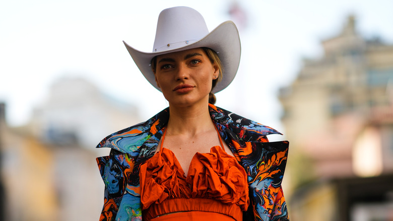 woman wearing white cowboy boots