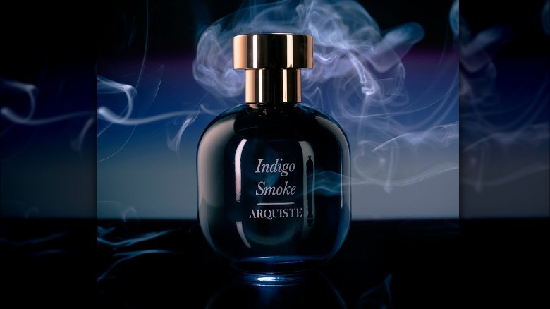 Fragrance bottle with blue smoke