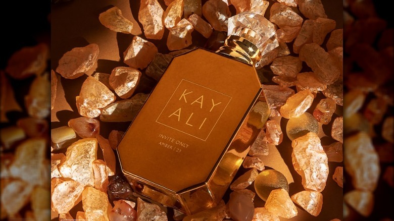 Fragrance bottle on amber stones