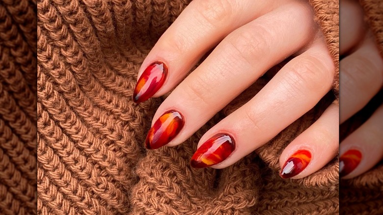 Tortoiseshell manicure brown sweater