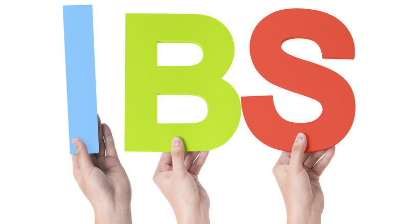 people holding IBS letters