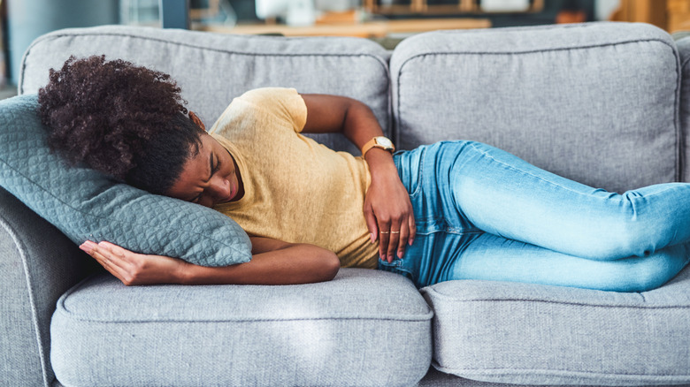 woman resting with cramps