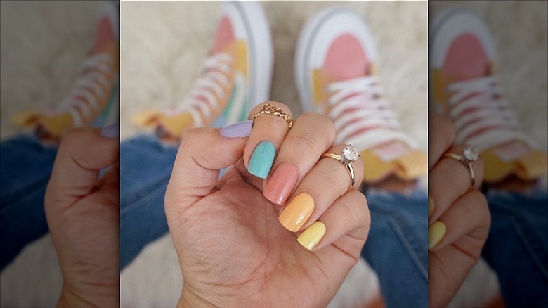 woman with pastel multicolored creamsicle nails