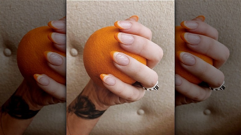 woman with two-toned creamsicle french mani