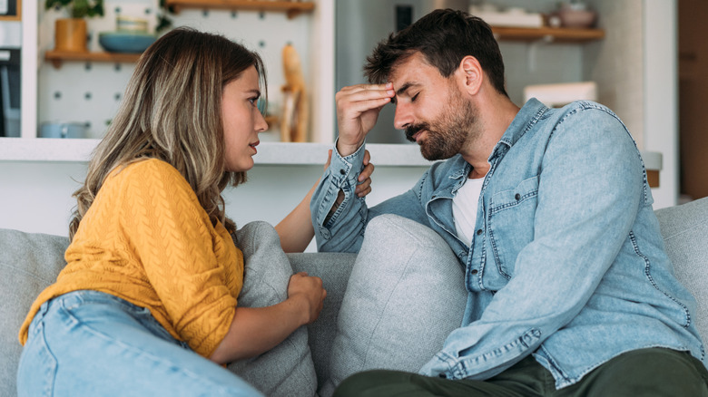 Woman comforts upset partner