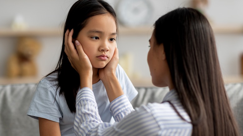 Mother consoling upset child