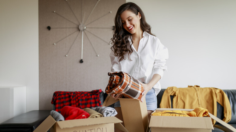 Woman cleaning out her closet