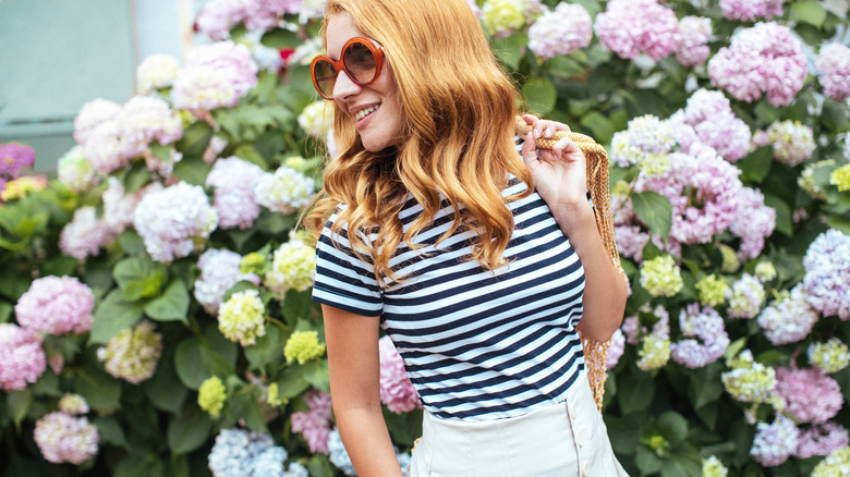 Girl wearing striped t-shirt, sunglasses