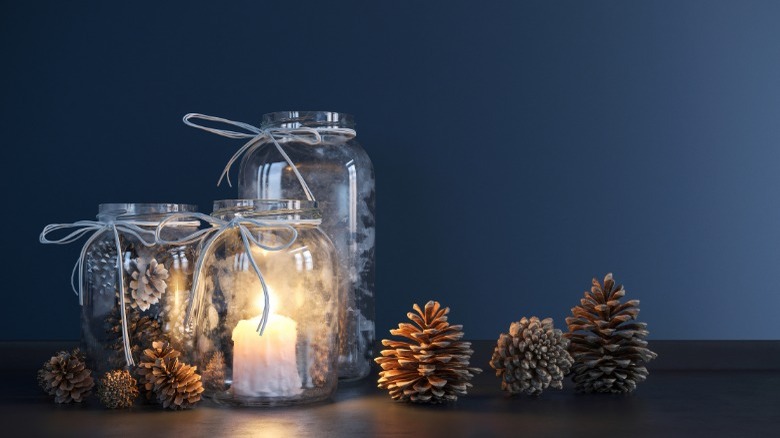 Jars filled with pine cones and candle