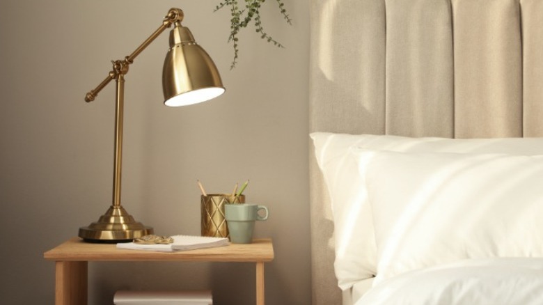 Nightstand with gold lamp