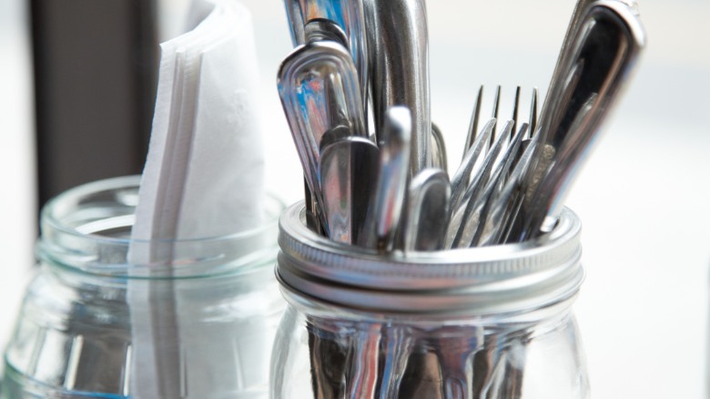 Assorted silverware in Mason jar