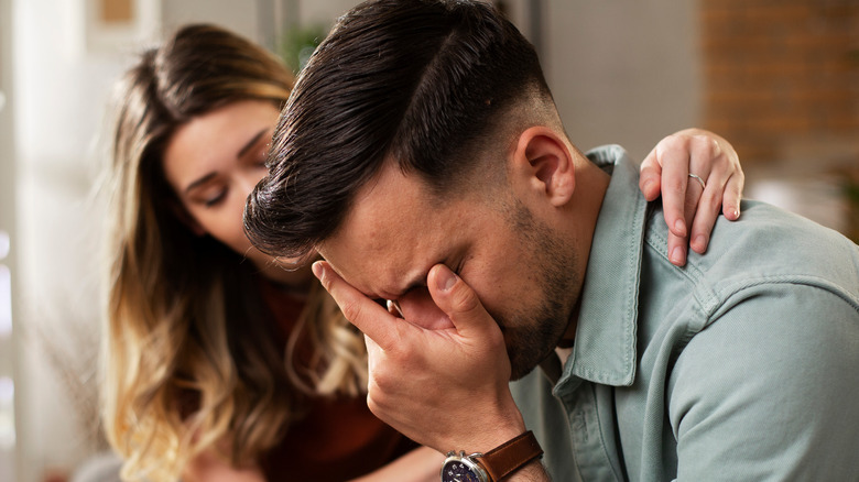 man crying with woman